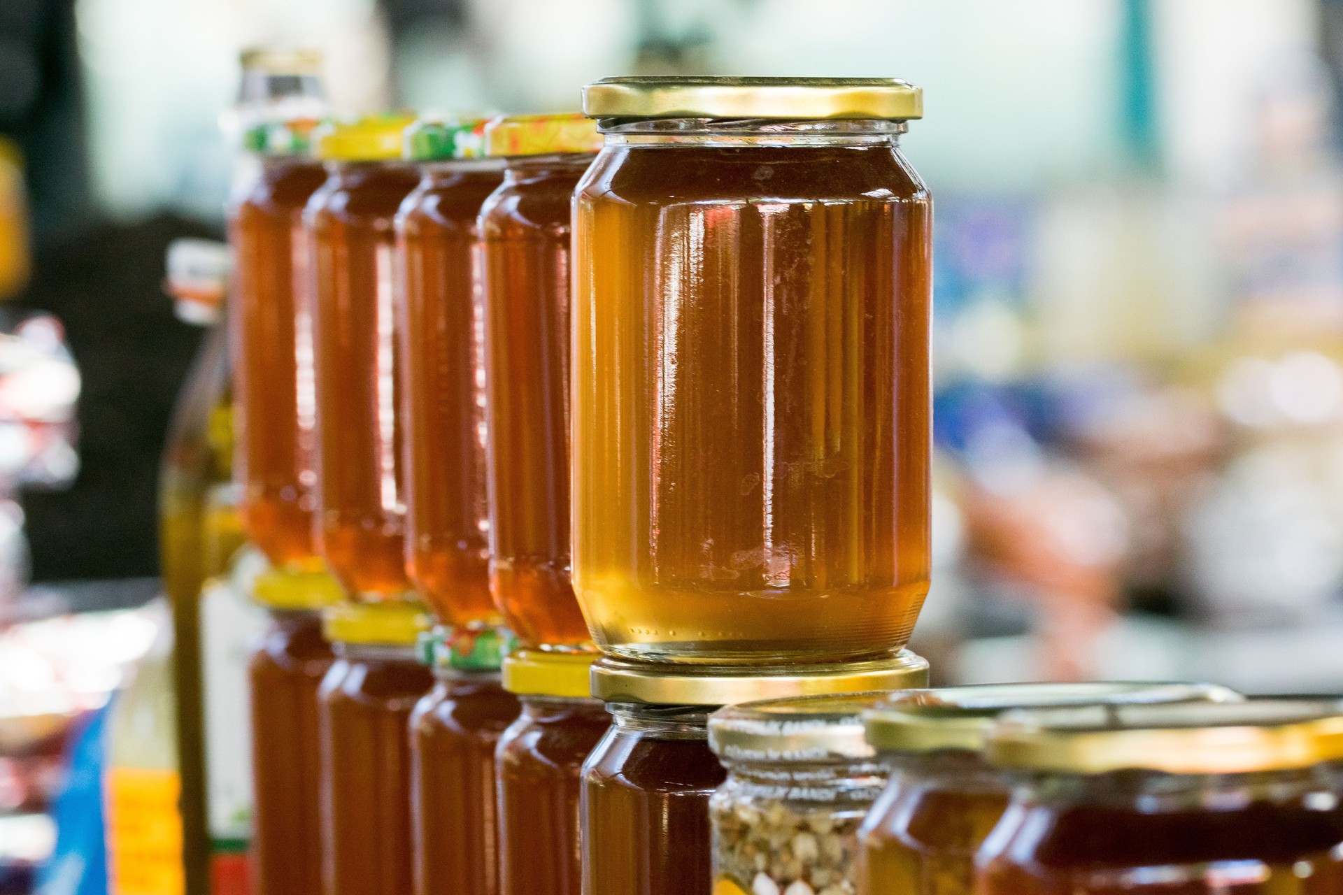 A row of natural jars of honey for sale at the stall of a green market vendor in Tetovo, Macedonia